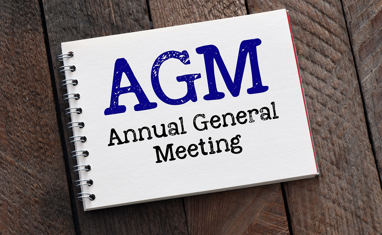 Agm Annual General Meeting Words In Notebook And Wooden